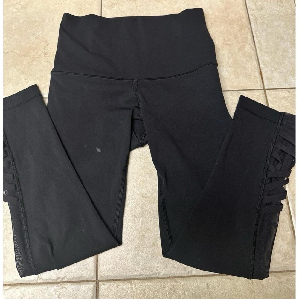 Lululemon High-Waisted Black Leggings with Mesh and Crisscross Detail, Size 4